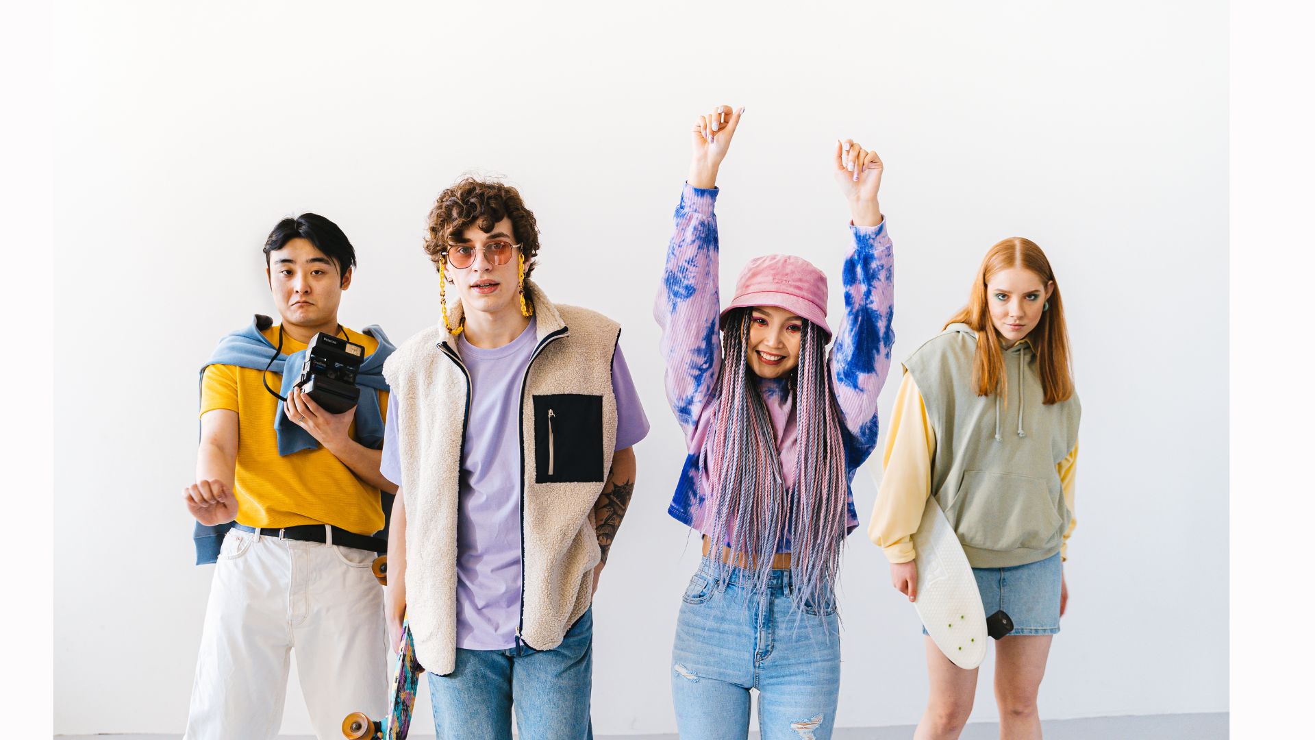 Flat lay of affordable streetwear items like graphic tees, joggers, denim jackets, and caps from popular urban fashion brands.