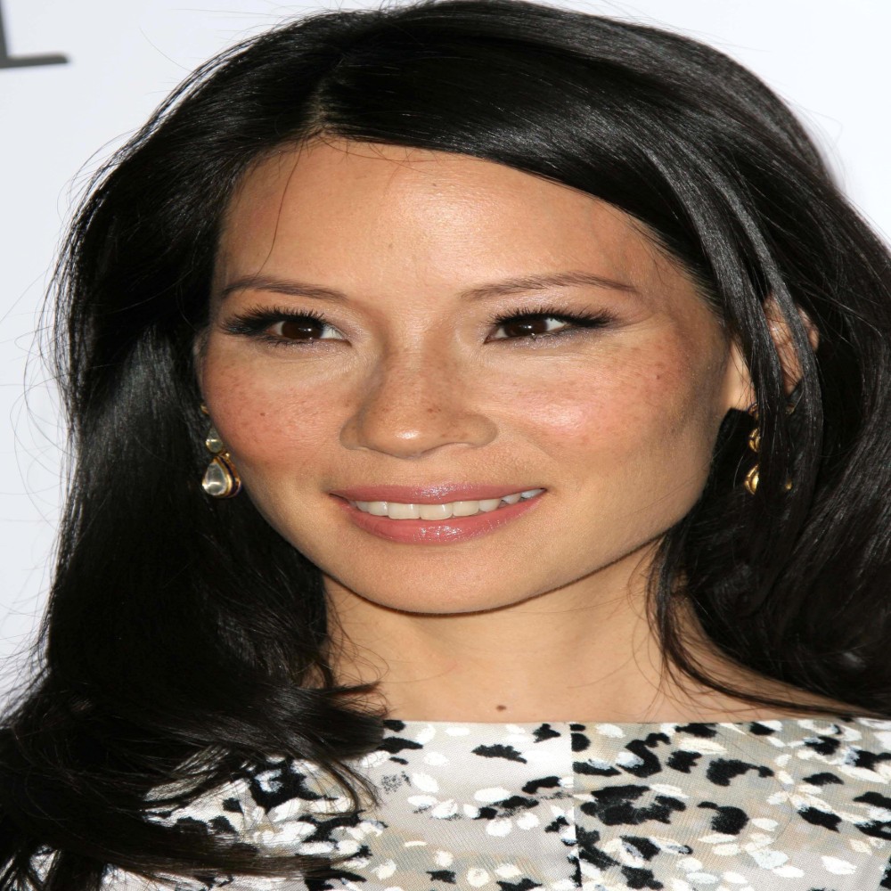 Lucy Liu a top Female celebrity from United States read their Biography and see, their social profiles and what designer brand clothing they have been seen wearing.